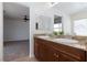 Bathroom showcasing double sinks, granite counters, and views into the next room at 1037 Water Cove St, Henderson, NV 89011