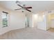 Spacious bedroom features a ceiling fan, neutral paint, and carpeting, offering a serene and comfortable space at 1037 Water Cove St, Henderson, NV 89011