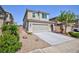 Attractive home featuring desert landscaping, a two-car garage, and private entry at 1037 Water Cove St, Henderson, NV 89011