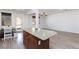 Open-concept kitchen featuring granite countertop, breakfast bar, eat-in kitchen and open space at 1037 Water Cove St, Henderson, NV 89011
