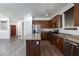Modern kitchen featuring stainless steel appliances, granite countertops, and breakfast bar at 1037 Water Cove St, Henderson, NV 89011