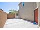 Side yard with an arched entry gate and concrete patio at 1037 Water Cove St, Henderson, NV 89011