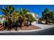 Two-story house featuring a three-car garage, well-maintained landscaping, and a rock-covered yard at 105 Chateau Whistler Ct, Las Vegas, NV 89148