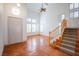 Bright and spacious entryway featuring staircase, shutters, and terra cotta tile flooring at 105 Chateau Whistler Ct, Las Vegas, NV 89148
