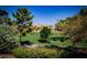 Scenic view of a well-maintained golf course, trees and other landscaping offering a tranquil view at 105 Chateau Whistler Ct, Las Vegas, NV 89148
