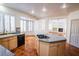 Bright kitchen features granite countertops, an island cooktop, and classic wooden cabinets at 105 Chateau Whistler Ct, Las Vegas, NV 89148