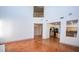 Bright living room with terra cotta tile flooring provides access to kitchen and additional rooms at 105 Chateau Whistler Ct, Las Vegas, NV 89148