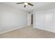 Neutral-toned bedroom featuring carpet, ceiling fan, and an closet with double doors for ample storage space at 1063 Silver Star St, Henderson, NV 89002