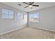Bright bedroom featuring two large windows allowing ample sunlight and ceiling fan for air circulation at 1063 Silver Star St, Henderson, NV 89002