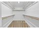 Walk-in closet with shelving on upper portion of walls and carpet at 1063 Silver Star St, Henderson, NV 89002