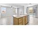 Kitchen island featuring granite countertop and stainless dishwasher with pool view at 1063 Silver Star St, Henderson, NV 89002