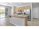 Kitchen island featuring granite countertop, stainless appliances and a pool view at 1063 Silver Star St, Henderson, NV 89002