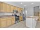 Spacious kitchen with stainless appliances, granite countertop, and tile flooring at 1063 Silver Star St, Henderson, NV 89002