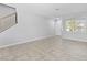 Inviting living room with tile floors, an entry door, and bright natural light throughout the space at 1063 Silver Star St, Henderson, NV 89002