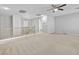Expansive loft with a ceiling fan, open doorways, carpet, and neutral walls offer versatility at 1063 Silver Star St, Henderson, NV 89002