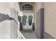 Inviting front entrance featuring double doors with decorative wreaths and oval glass inserts at 10638 La Spezia Way, Las Vegas, NV 89141