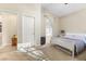A serene main bedroom with a soaking tub, ensuite bathroom, and neutral decor creating a tranquil retreat at 10638 La Spezia Way, Las Vegas, NV 89141