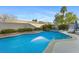 Backyard pool with a spa, surrounded by desert landscaping and a privacy wall, perfect for outdoor relaxation at 10638 La Spezia Way, Las Vegas, NV 89141