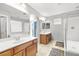 Bright bathroom featuring double sinks, a separate shower, and a tub for a luxurious experience at 1165 Cactus Rock St, Henderson, NV 89011