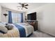 Comfortable bedroom with a ceiling fan, plush bedding, and ample natural light, providing a serene atmosphere at 1165 Cactus Rock St, Henderson, NV 89011