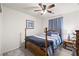 Cozy bedroom with a ceiling fan, blue accents, and a comfortable bed, offering a relaxing retreat at 1165 Cactus Rock St, Henderson, NV 89011