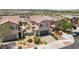 Home featuring a paved driveway, desert landscaping, and a two-car garage at 1165 Cactus Rock St, Henderson, NV 89011