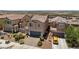 Suburban home showcasing a two-car garage, paved driveway, and desert landscaping at 1165 Cactus Rock St, Henderson, NV 89011