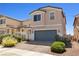 Two-story home featuring low maintenance landscaping and a brick driveway at 1165 Cactus Rock St, Henderson, NV 89011