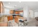 Open kitchen layout with stainless steel appliances and a granite topped island with seating at 1165 Cactus Rock St, Henderson, NV 89011