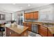 Modern kitchen with granite countertops, stainless steel appliances, and ample cabinet space open to the living area at 1165 Cactus Rock St, Henderson, NV 89011