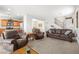 Comfortable living room showcasing a staircase and a connection to other spaces at 1165 Cactus Rock St, Henderson, NV 89011