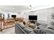 Spacious living room with plush gray sectional sofa, entertainment center, and staircase at 1165 Cactus Rock St, Henderson, NV 89011