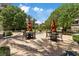 Outdoor seating area with shade trees offering a relaxing space at 120 Los Cabos Dr # 301, Las Vegas, NV 89144