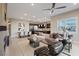 Open-concept living room with fireplace, dining area, and kitchen view at 120 Los Cabos Dr # 301, Las Vegas, NV 89144