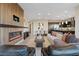 Open-concept living room with a modern fireplace and a view to the kitchen at 120 Los Cabos Dr # 301, Las Vegas, NV 89144
