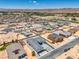 An aerial view shows a new modern home in a desert community, boasting new construction and spacious layouts at 1525 Heights Dr, Logandale, NV 89021