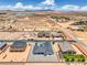 Wide aerial perspective highlighting a modern home surrounded by desert terrain and distant mountains at 1525 Heights Dr, Logandale, NV 89021