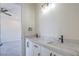 A bathroom vanity with a marble countertop and modern fixtures sits adjacent to a bedroom at 1525 Heights Dr, Logandale, NV 89021