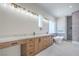 A modern bathroom with double vanities and a sleek, standalone soaking tub, along with tile flooring at 1525 Heights Dr, Logandale, NV 89021