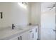 A modern bathroom vanity with marble countertop and black fixtures sits adjacent to a bedroom at 1525 Heights Dr, Logandale, NV 89021