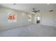 Spacious bedroom with connecting bathroom and large, bright windows at 1525 Heights Dr, Logandale, NV 89021