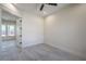 Bright bedroom with tile flooring and a view into the hallway through the open doors at 1525 Heights Dr, Logandale, NV 89021
