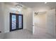 Grand foyer featuring decorative double doors, chandelier, and an open view into another room at 1525 Heights Dr, Logandale, NV 89021