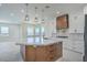 Modern kitchen with a large island, custom wood cabinets, and stainless steel appliances at 1525 Heights Dr, Logandale, NV 89021