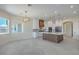 Open-concept kitchen featuring custom wood cabinets, a large island, and ample natural light at 1525 Heights Dr, Logandale, NV 89021