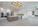 Spacious kitchen with a large island, modern appliances, and stylish lighting fixtures at 1525 Heights Dr, Logandale, NV 89021