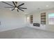 Large living room with built-in shelves, modern fireplace, and bright natural light at 1525 Heights Dr, Logandale, NV 89021