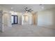 Large primary bedroom featuring tile flooring, ceiling fan, and decorative doors at 1525 Heights Dr, Logandale, NV 89021