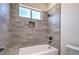 A modern tiled shower with wood-look tiles and a single shower head at 1525 Heights Dr, Logandale, NV 89021