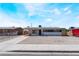 Charming single-story home featuring a neutral color scheme, gravel landscaping, and a well-maintained exterior at 1648 J St, Las Vegas, NV 89106